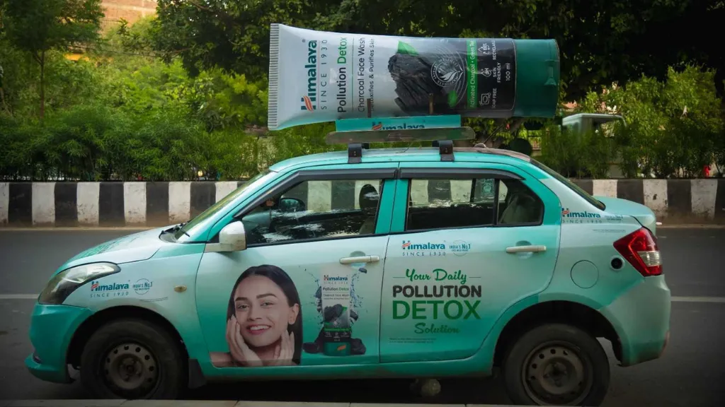 How FMCG Brands Are Driving Mobile-First Awareness via Cab Branding Himalayan Charcoal Facewash 3D Cab Branding Campaign